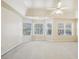 Main bedroom with bay windows and ceiling fan at 589 Lantern Wood Dr, Scottdale, GA 30079