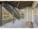 Concrete patio with wooden stairs leading to backyard at 589 Lantern Wood Dr, Scottdale, GA 30079