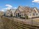 Side view of home showcasing stone accents and private backyard at 224 Orchards Cir, Woodstock, GA 30188