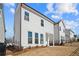 A serene backyard featuring a private fenced yard, lush landscaping, and a lovely lawn at 627 Skytop Dr, Cumming, GA 30040