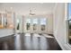 Light-filled living room with dark hardwood floors, recessed lighting, and large windows with scenic views at 627 Skytop Dr, Cumming, GA 30040