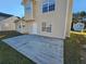Large concrete patio extends from the back of the house, offering ample outdoor space at 145 W Village W Ct, Riverdale, GA 30296