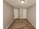 Spacious bedroom with wood-look floors and neutral walls at 145 W Village W Ct, Riverdale, GA 30296
