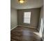 Bright bedroom with wood-look floors and window at 145 W Village W Ct, Riverdale, GA 30296