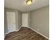 Bedroom with wood-look floors and neutral walls at 145 W Village W Ct, Riverdale, GA 30296