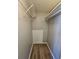 Walk-in closet with wire shelving and wood-look flooring at 145 W Village W Ct, Riverdale, GA 30296