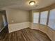 Spacious dining room featuring hardwood floors and bay windows at 145 W Village W Ct, Riverdale, GA 30296