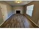 Living room with fireplace and hardwood floors at 145 W Village W Ct, Riverdale, GA 30296