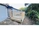 View of the unfinished back deck with wooden railings and steps to the backyard at 2436 Clarissa Nw Dr, Atlanta, GA 30318