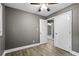Bedroom featuring ceiling fan, neutral walls, and convenient access to adjacent rooms through open doorways at 2436 Clarissa Nw Dr, Atlanta, GA 30318
