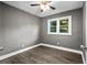 The bedroom features modern wood flooring and a ceiling fan, providing a comfortable and stylish space at 2436 Clarissa Nw Dr, Atlanta, GA 30318