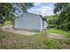 Exterior view of the home showing the driveway, siding, and greenery at 2436 Clarissa Nw Dr, Atlanta, GA 30318