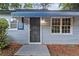 Close-up of the front door with a decorative metal security screen and painted blue trim at 2436 Clarissa Nw Dr, Atlanta, GA 30318