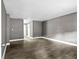 Spacious living room featuring laminate wood flooring, neutral paint, and crisp white trim at 2436 Clarissa Nw Dr, Atlanta, GA 30318
