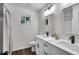 Bathroom with a double sink vanity, a neutral color scheme, and bright lighting at 6881 Hickory Hollow Dr, Douglasville, GA 30135