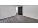 A bright bedroom with gray carpet and fresh paint, creating a modern and cozy feel at 6881 Hickory Hollow Dr, Douglasville, GA 30135