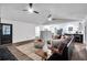 Open floor plan with a brown leather couch, and a view into the kitchen at 6881 Hickory Hollow Dr, Douglasville, GA 30135