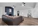 Living room with L-shaped sectional sofa and stone fireplace at 6881 Hickory Hollow Dr, Douglasville, GA 30135