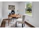 Bright home office with wood desk and large window at 3569 Lynne Rd, Powder Springs, GA 30127