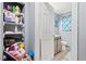This bathroom features new wood cabinets, a white toilet, and a window at 3530 Fairlane Nw Dr, Atlanta, GA 30331
