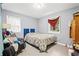 This cozy bedroom features natural light, a comfortable bed, and ample space at 3530 Fairlane Nw Dr, Atlanta, GA 30331