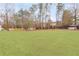 Large backyard with grassy area and storage shed at 1214 Glen Devon Pl, Powder Springs, GA 30127