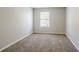 Bright bedroom with neutral walls and carpet at 3100 Aberdeen Way, Lithonia, GA 30038