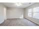 Bright bedroom featuring carpet and ceiling fan at 3100 Aberdeen Way, Lithonia, GA 30038