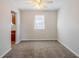 Spacious living room with neutral walls and carpeted floors at 3100 Aberdeen Way, Lithonia, GA 30038