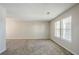 Spacious living room with carpeted floor and two windows at 3100 Aberdeen Way, Lithonia, GA 30038