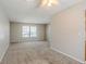 Bright living room featuring neutral walls and carpeted floors at 3100 Aberdeen Way, Lithonia, GA 30038