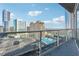 Enjoy stunning views of the city skyline and a refreshing pool from this private balcony with a glass railing at 3325 Piedmont Ne Rd # 1708, Atlanta, GA 30305