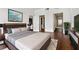 Modern bedroom with ensuite bath, hardwood floors, and sleek contemporary decor at 3325 Piedmont Ne Rd # 1708, Atlanta, GA 30305