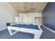 Entertain in the game room with a sleek white pool table, comfortable seating, and modern lighting at 3325 Piedmont Ne Rd # 1708, Atlanta, GA 30305