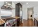 Well-equipped kitchen with stainless steel range hood and professional-grade gas cooktop at 3325 Piedmont Ne Rd # 1708, Atlanta, GA 30305