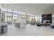 Spacious living room boasts floor-to-ceiling windows, modern lighting, and a sleek fireplace for luxurious living at 3325 Piedmont Ne Rd # 1708, Atlanta, GA 30305