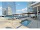 Relax by the pool and hot tub with comfortable lounge chairs and tables under a sunny sky at 3325 Piedmont Ne Rd # 1708, Atlanta, GA 30305