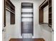 Custom walk-in closet features wood shelves, drawers, hanging rods, and a wire basket for optimal storage and organization at 3325 Piedmont Ne Rd # 1708, Atlanta, GA 30305