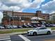 Exterior view of a large brick building next to train tracks on a clear day at 304 Woodstock Seven Dr, Woodstock, GA 30188