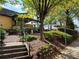 Cozy patio area with comfortable seating and lush greenery for outdoor dining at 304 Woodstock Seven Dr, Woodstock, GA 30188
