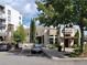 Exterior view of Primo 120 Restaurant featuring outdoor seating, lush landscaping, and convenient parking at 304 Woodstock Seven Dr, Woodstock, GA 30188