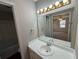 Clean bathroom with a white vanity and a large mirror at 5090 Great Meadows Rd, Lithonia, GA 30038