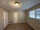 Bright bedroom with neutral walls and carpet flooring at 5090 Great Meadows Rd, Lithonia, GA 30038