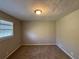Simple bedroom with neutral walls and carpet at 5090 Great Meadows Rd, Lithonia, GA 30038