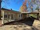 Rear view of house, screened porch, and carport at 5090 Great Meadows Rd, Lithonia, GA 30038