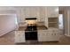 Updated kitchen featuring white cabinets and a gas range at 5090 Great Meadows Rd, Lithonia, GA 30038