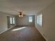 Sunlit living room showcasing ample space and neutral tones at 5090 Great Meadows Rd, Lithonia, GA 30038