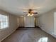 Bright living room with hardwood floors and a ceiling fan at 5090 Great Meadows Rd, Lithonia, GA 30038