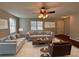 Spacious living room featuring plush sofas, a coffee table, and large windows at 5090 Great Meadows Rd, Lithonia, GA 30038
