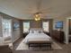 Main bedroom with a king-size bed and large windows at 5090 Great Meadows Rd, Lithonia, GA 30038